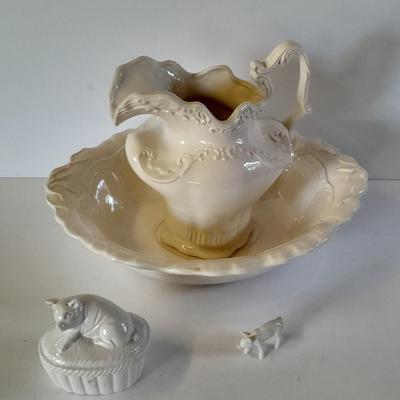 Pitcher with bowl and collectible pig figures