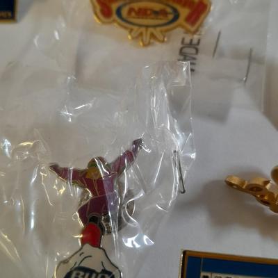 Assortment of hat pins - New York, stamp replica's and more