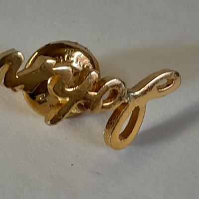 Assortment of hat pins - New York, stamp replica's and more