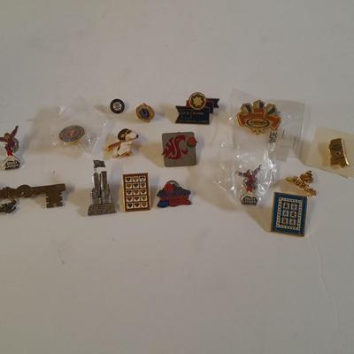 Assortment of hat pins - New York, stamp replica's and more