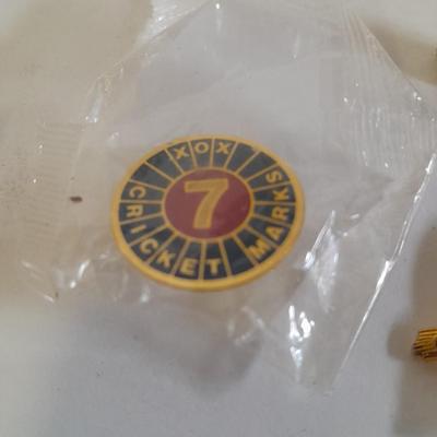 Assortment of hat pins - New York, stamp replica's and more