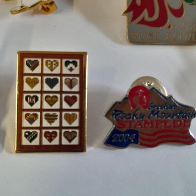 Assortment of hat pins - New York, stamp replica's and more