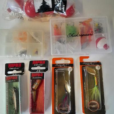 Assortment of Fishing lures new in boxes and other fishing tackle. Rapala Lures