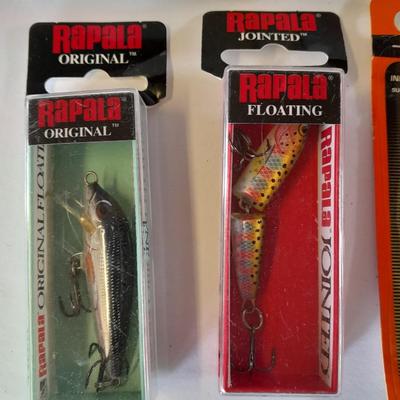 Assortment of Fishing lures new in boxes and other fishing tackle. Rapala Lures