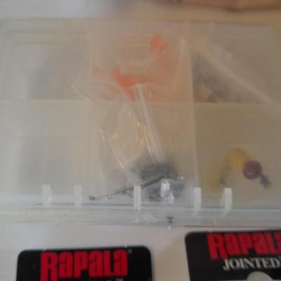 Assortment of Fishing lures new in boxes and other fishing tackle. Rapala Lures