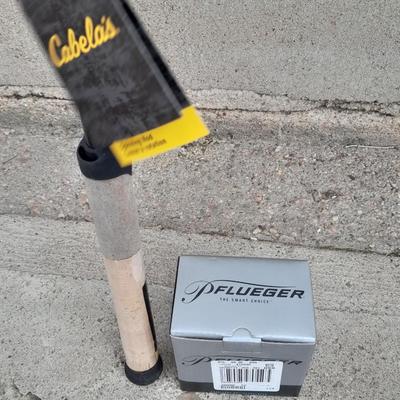 BRAND NEW FISHING POLE AND REEL New Cabela's Fish Eagle 6'6" Spinning rod with new Pflueger open face reel