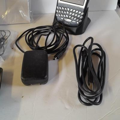 Two older Blackberry Phones with accessories