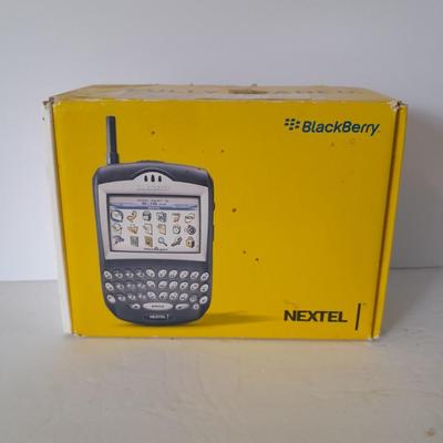 Two older Blackberry Phones with accessories