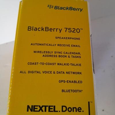 Two older Blackberry Phones with accessories