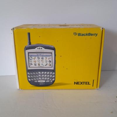 Two older Blackberry Phones with accessories