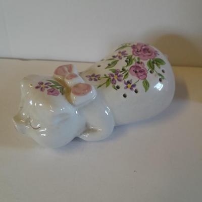 Framed wall art, vase with faux flowers, and pig figures -- piggy bank