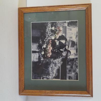 Framed wall art, vase with faux flowers, and pig figures -- piggy bank