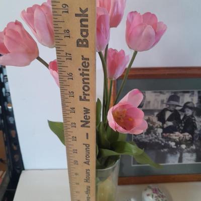 Framed wall art, vase with faux flowers, and pig figures -- piggy bank