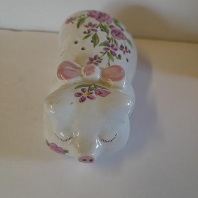Framed wall art, vase with faux flowers, and pig figures -- piggy bank
