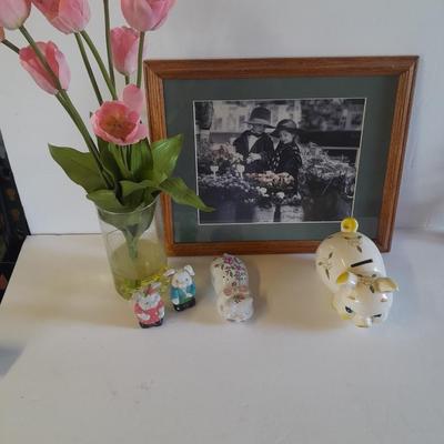 Framed wall art, vase with faux flowers, and pig figures -- piggy bank