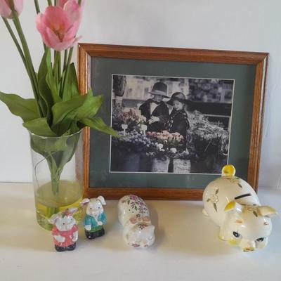 Framed wall art, vase with faux flowers, and pig figures -- piggy bank