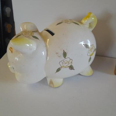 Framed wall art, vase with faux flowers, and pig figures -- piggy bank