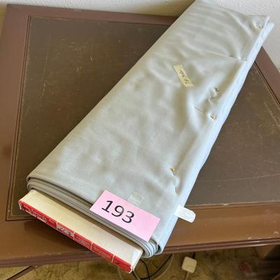 Bolt of gray fabric