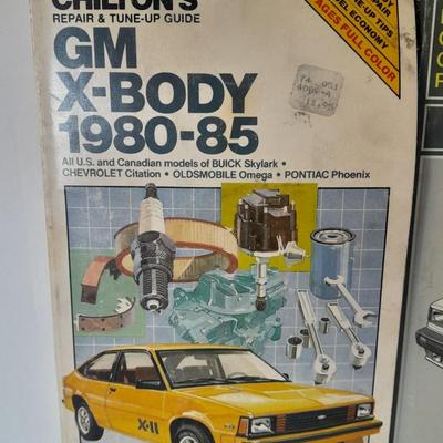 Two auto mechanic books, Chilton's manuals, GM X-Body and Buick skylark, Oldsmobile, and others