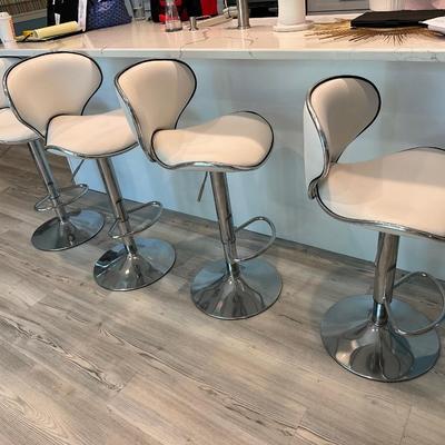Four white leather and chrome stools