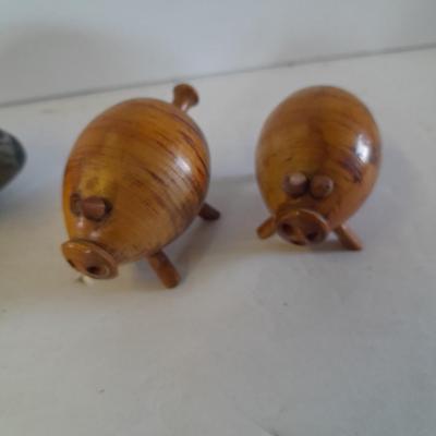 Five small pig figures, wood pigs, floral salt & pepper, and a pottery pig