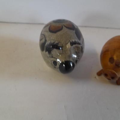 Five small pig figures, wood pigs, floral salt & pepper, and a pottery pig