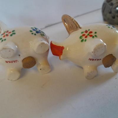Five small pig figures, wood pigs, floral salt & pepper, and a pottery pig