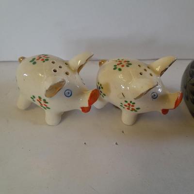 Five small pig figures, wood pigs, floral salt & pepper, and a pottery pig
