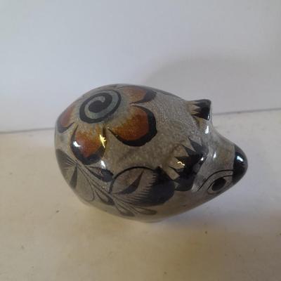 Five small pig figures, wood pigs, floral salt & pepper, and a pottery pig