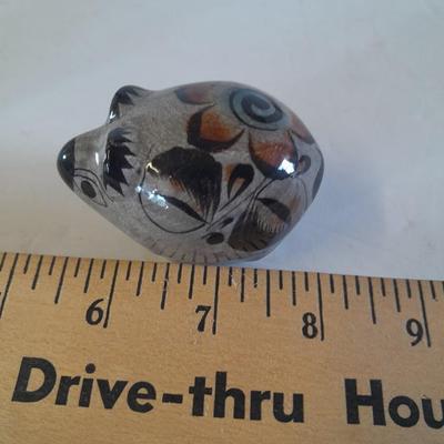 Five small pig figures, wood pigs, floral salt & pepper, and a pottery pig