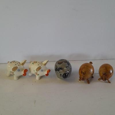 Five small pig figures, wood pigs, floral salt & pepper, and a pottery pig