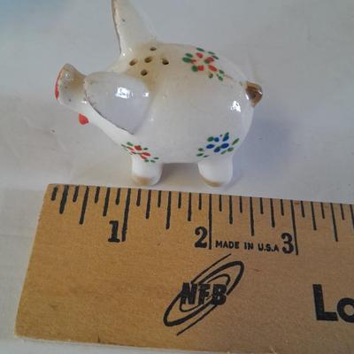 Five small pig figures, wood pigs, floral salt & pepper, and a pottery pig