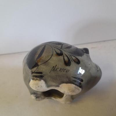 Five small pig figures, wood pigs, floral salt & pepper, and a pottery pig