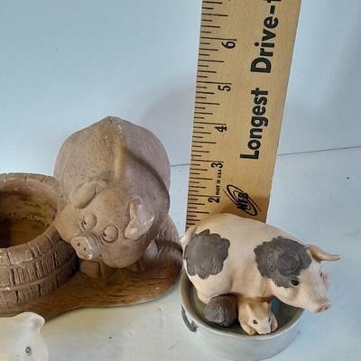 Eight Farm themed pig collectible figures -