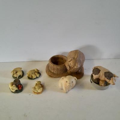 Eight Farm themed pig collectible figures -