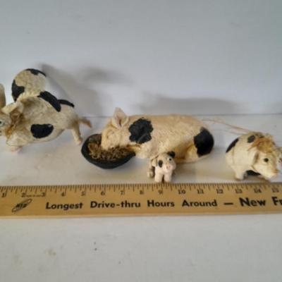 Black and white pig figures, flying pig shelf sitter, and more