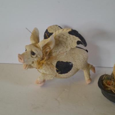 Black and white pig figures, flying pig shelf sitter, and more