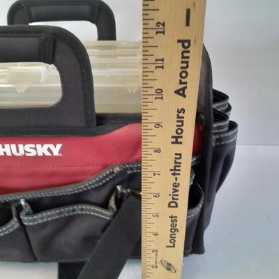 Husky tool bag with plastic insert organizing boxes.
