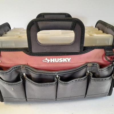 Husky tool bag with plastic insert organizing boxes.