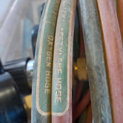 Acetylene and Oxygen hoses with gauges, torch tips and new replacement hoses