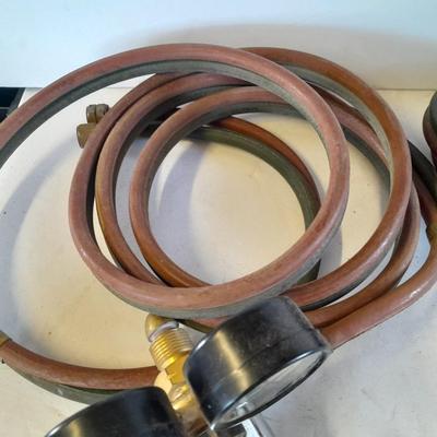 Acetylene and Oxygen hoses with gauges, torch tips and new replacement hoses
