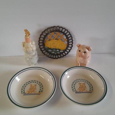 Pig Kitchen items metal trivet, soap dispenser, bowls, and pig figure