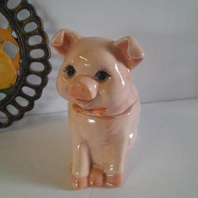 Pig Kitchen items metal trivet, soap dispenser, bowls, and pig figure