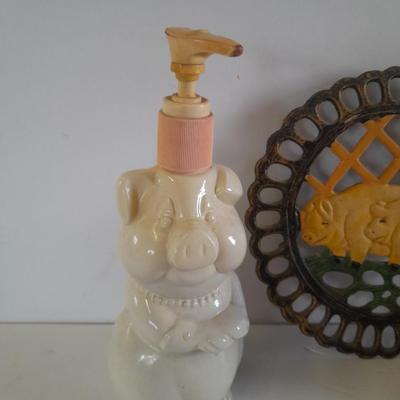 Pig Kitchen items metal trivet, soap dispenser, bowls, and pig figure