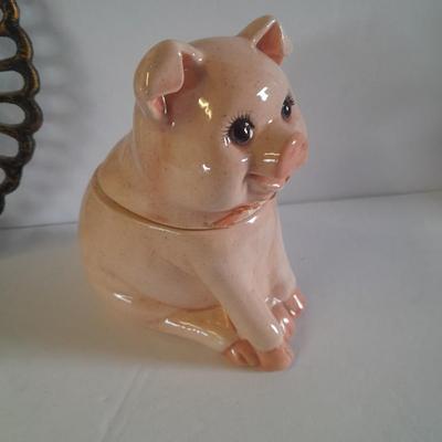 Pig Kitchen items metal trivet, soap dispenser, bowls, and pig figure