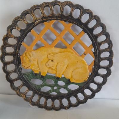 Pig Kitchen items metal trivet, soap dispenser, bowls, and pig figure