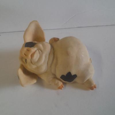Collection of four Black and white pig figures