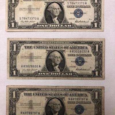 Three series 1957 silver certificates