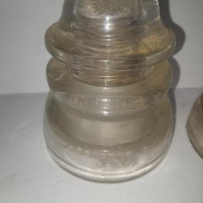 Four clear glass Hemingray Insulators