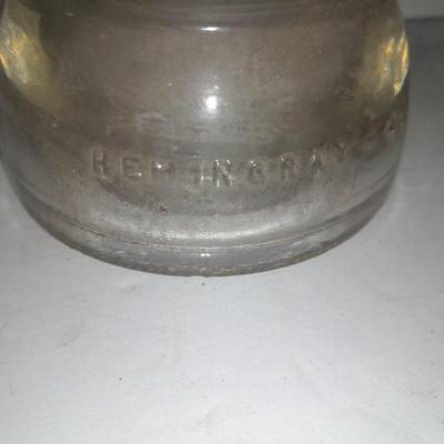Four clear glass Hemingray Insulators